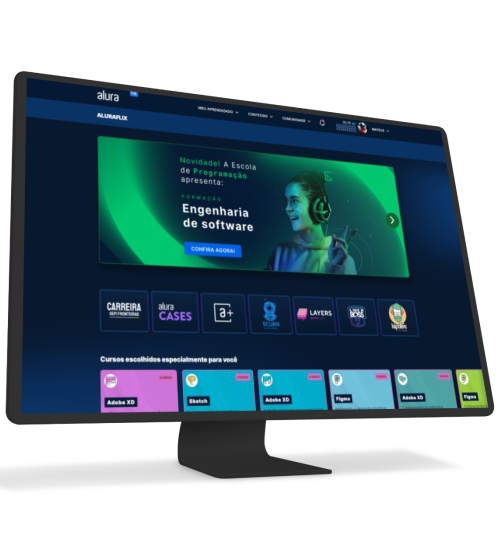 Computador e celular com o site da alura abertos.